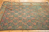 Distressed Malayer rug with low pile, raspberry paisley boteh, and blue vinery pattern.