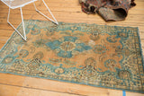 Gold and powder blue distressed Tabriz rug with scalloped medallion and floating border.