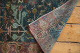 Hand knotted foundation and low pile showing faded red, denim blue tones.