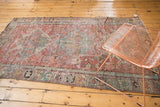 Distressed geometric patterns and motifs on a corner of this antique Soumac rug.
