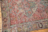 Storied geometric border of an antique Distressed Caucasian Soumac rug, with faded blush and slate blue.