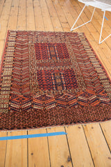 Vintage Turkmen rug corner displaying geometric serrated leaves and rams horn border.