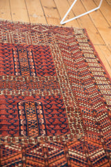 Vintage Turkmen rug detail: prayer niche with geometric motifs, terracotta and navy.