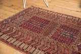 Reciprocating rams horn border framing prayer niche on a vintage Turkmen rug.