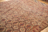 Antique Beshir carpet's intricate germinating plant panels, terracotta, aubergine, navy hues, even wear and border.