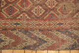 Frayed hand-knotted fringe and geometric lower border showing mostly even wear.