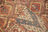 Antique Beshir Carpet folded corner, revealing hand-knotted foundation and germinating plant panels.