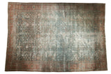 Distressed vintage Mahal carpet, allover faded teal geometric field, terra cotta border.