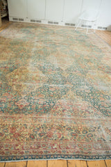 Softer terracotta, ivory, and sea foam green tones in the distressed millefleur floral borders and field.