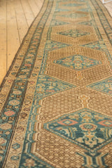 Textured pile of a distressed Serab runner, showing geometric herati motifs and intricate border.