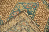Folded Serab runner showing even pile wear, geometric lattice, and blue field patterns.