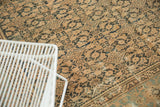 Vintage Distressed Malayer carpet, rhythmic herati pattern, dark navy on coffee bronze, with notable wear.