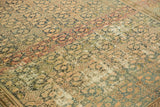Distressed vintage Malayer rug with rhythmic abrashes and worn texture to foundation.