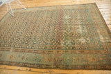 Vintage distressed Malayer carpet, central blush red stripe over herati pattern and foundation wear.