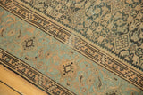 Distressed vintage Malayer carpet detail: powder blue border, coffee brown field, and wear to knot heads.
