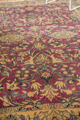 Detail of Lilihan carpet's unusual purple and gold floral vinery with dramatic contours.