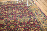 Vibrant purple, gold, and blue expressive floral vinery on vintage Lilihan carpet.
