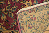 Rich red floral pile of Lilihan carpet with its intricately patterned hand-knotted beige back.