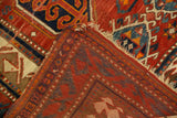Vintage Kazak carpet folded, revealing vibrant geometric pile and hand-knotted foundation.