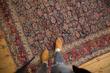 Cherry red main border of vintage Bijar carpet with intricate budded blossom design.