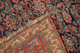 Vintage Bijar carpet's folded corner, fringe, Herati motif, and intricate main border.