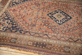 End of Qashqai rug, spot cross-stitching, tatter, tribal borders, rust and navy.