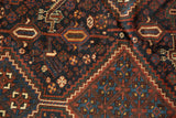 Detailed geometric motifs and floral cross-sections on the antique Kamseh carpet field.