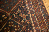 Hand-knotted antique Kamseh carpet: stylized bird motif within geometric patterns.