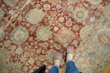Distressed vintage Tabriz rug, faded cherry red palmette motif and powder blue border.