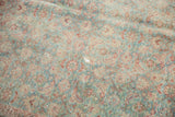 Time-softened slate blue-green, wine red, and ivory tones of a distressed Persian Tabriz Herati pattern.
