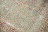 Vintage distressed Tabriz texture with faded slate blue and wine red Herati design.