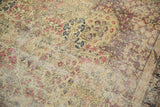 Antique Kerman carpet mil fleur pattern, cochineal red, navy blue, ivory, with mostly even wear.
