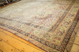 Late 19th-century Persian Kerman rug corner, showing ornate mil fleur borders in ivory and cochineal.