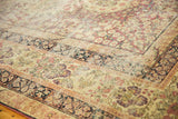 Ornate mil fleur design on antique Kerman carpet, cochineal red, ivory, navy, mostly even wear.