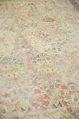 Ornate mil fleur pattern in cochineal red, ivory, and navy, with mostly even wear.