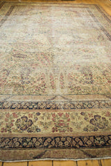 Ornate navy blue border, mil fleur tree of life, mostly even wear on an Antique Kerman.