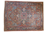 Vintage Heriz carpet with oversized medallion, vivid aqua blue spandrels, cherry red and navy blue.