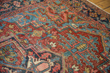Phenomenal vivid aqua blue corner spandrel with cherry red field, low pile Heriz carpet.