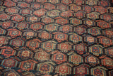 Navy blue ground Heriz rug with red, blue, beige allover boteh pattern, showing faint foundation.