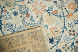Traditional Tabriz carpet reverse with ivory, navy scrolling palmettes.