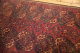 Vintage Ersari carpet: low pile with visible foundation, dark red, navy Gul pattern.