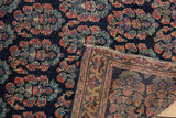 Fine weave of antique Afshar rug showing intricate boteh pattern and geometric border.