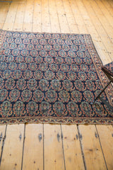 Secured end and stabilized outer border of antique Afshar rug with detailed boteh pattern.