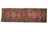 Distressed vintage Karaja rug runner, 1930s, with geometric medallions in wine red, dark teal, gold, 3x9.5.