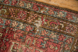 Distressed Karaja runner pile detail showing geometric design, wine red, teal, and visible foundation.
