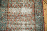 Distressed Serbend runner: worn terracotta boteh, sky blue hues, and visible ivory foundation.