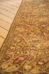 Distressed Malayer runner with worn boteh paisley, soft gold, blush, and beige tones.