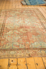 Geometric gul motifs with distressed pale copper and powder blue pile texture.