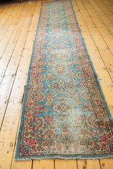 Restored end of vintage Kerman runner, sky blue floral field with cochineal red, low pile.