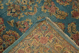 Vintage Kerman rug with floral pile and detailed hand-knotted foundation in sky blue.